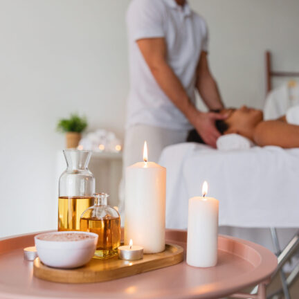 A tranquil spa atmosphere is created with softly lit candles and a variety of aromatic therapeutic oils